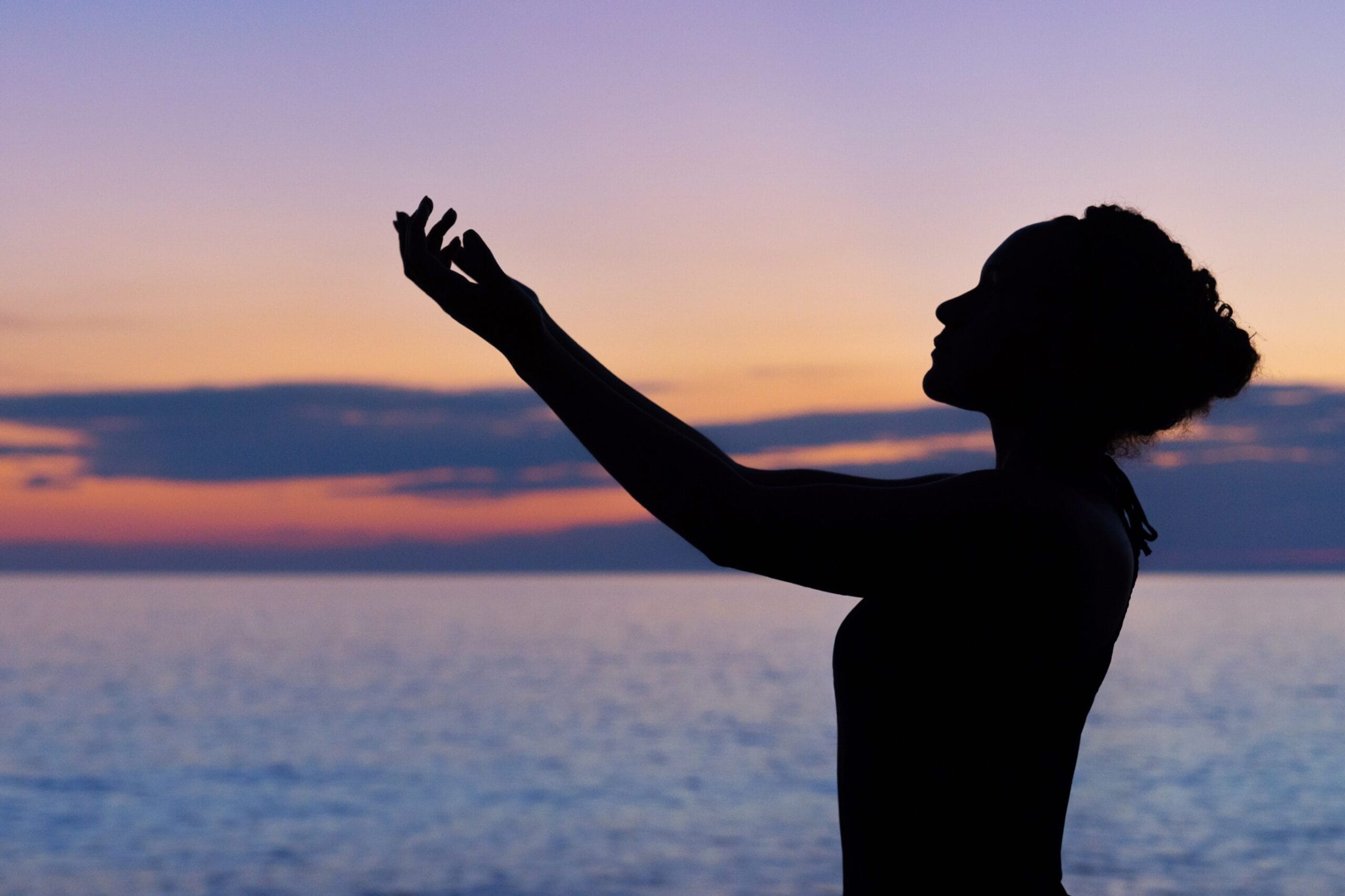 woman grateful for guided imagery on the beach