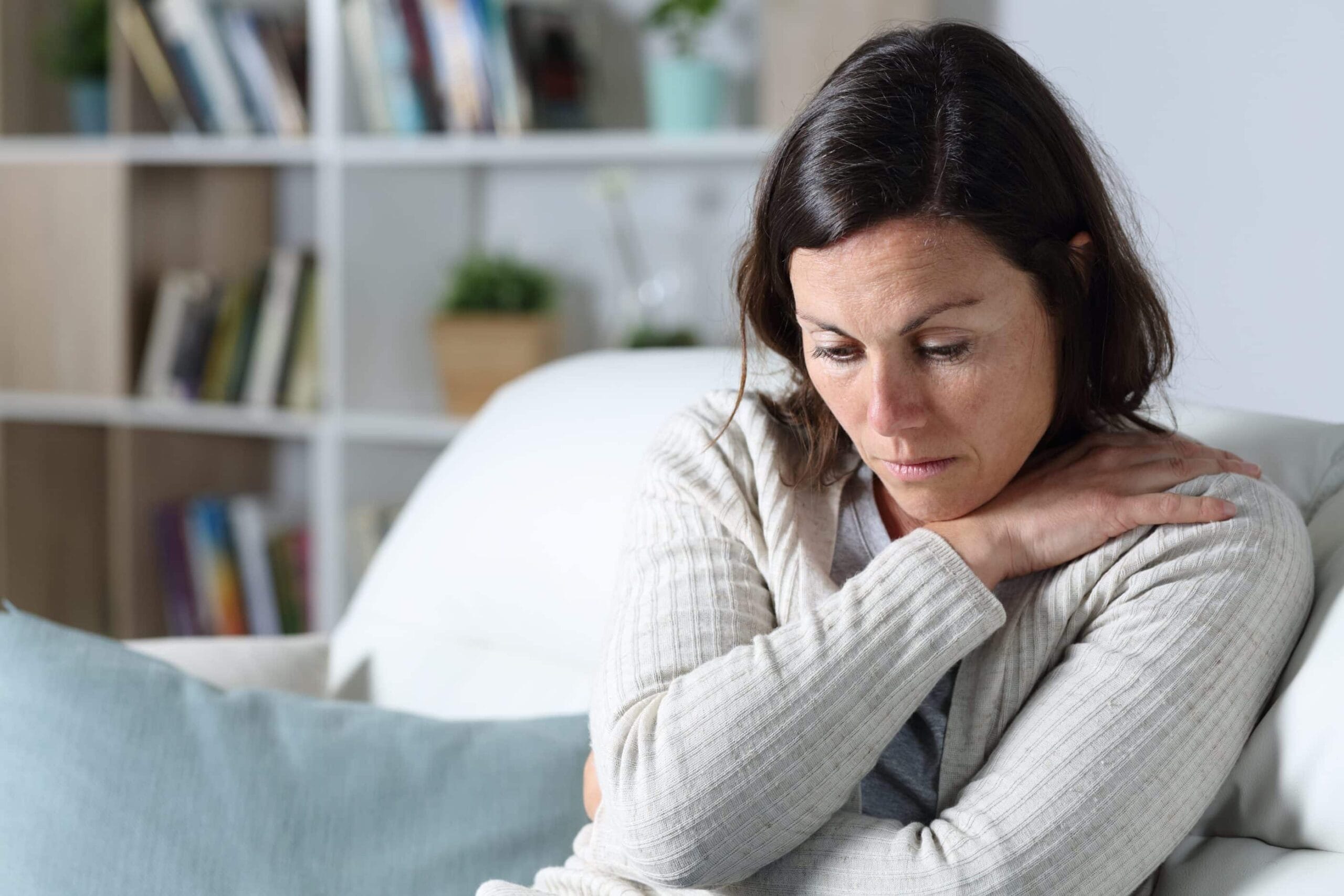 Woman struggling with symptoms of severe depression