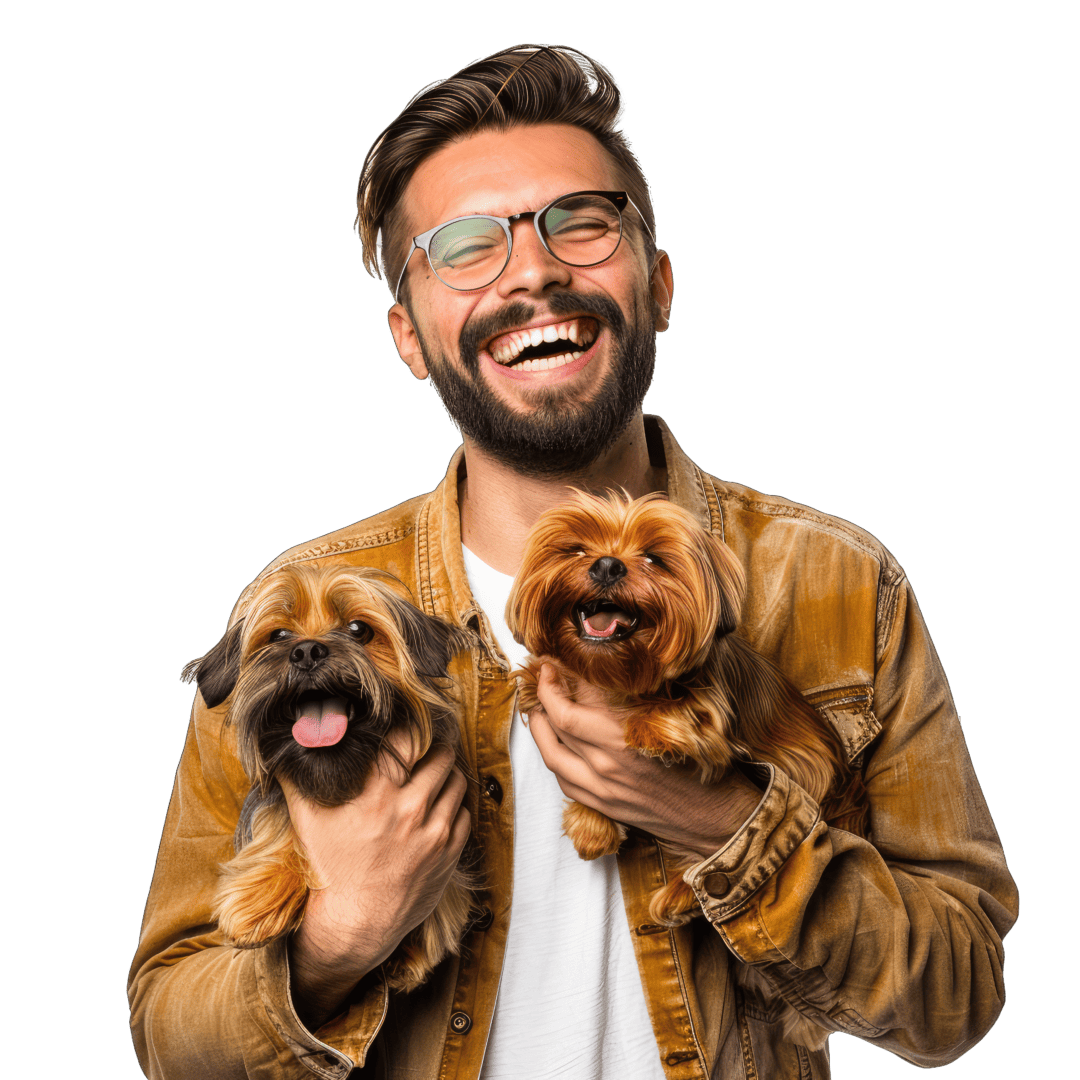 Man holding his dogs and smiling