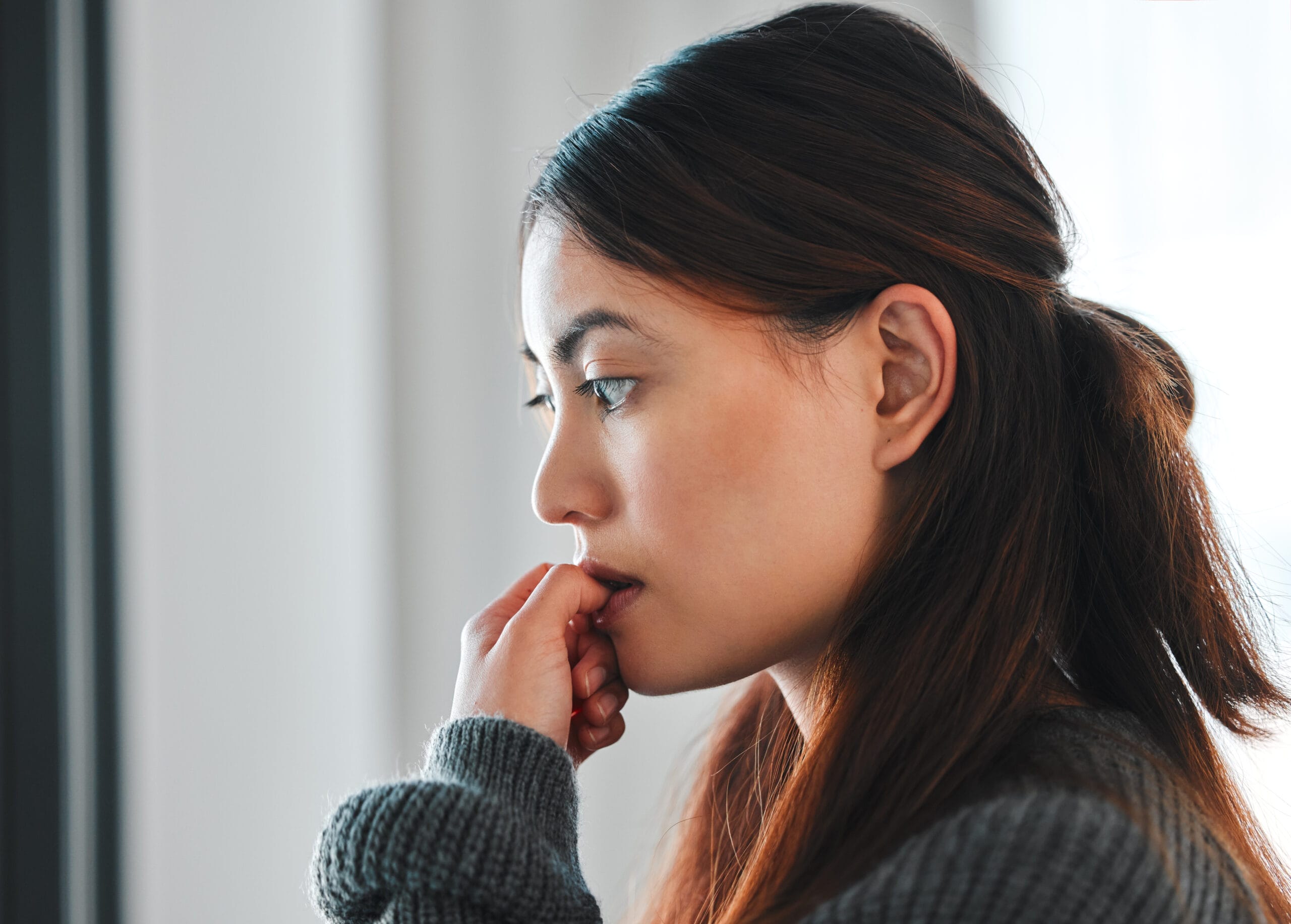 Person With Paranoid Personality Disorder Biting Their Fingernails