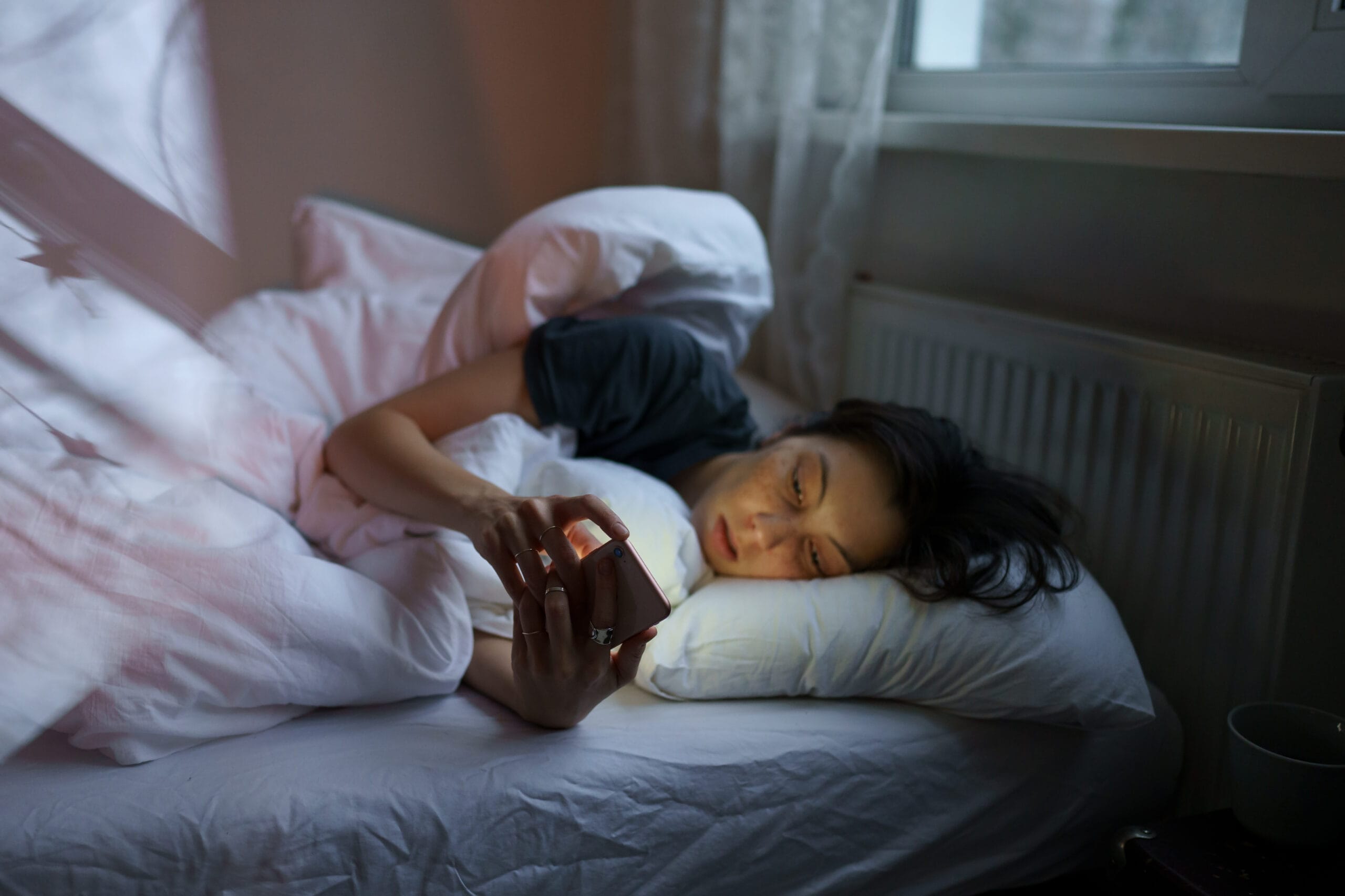 Depressed Women on her Phone Bed Rotting