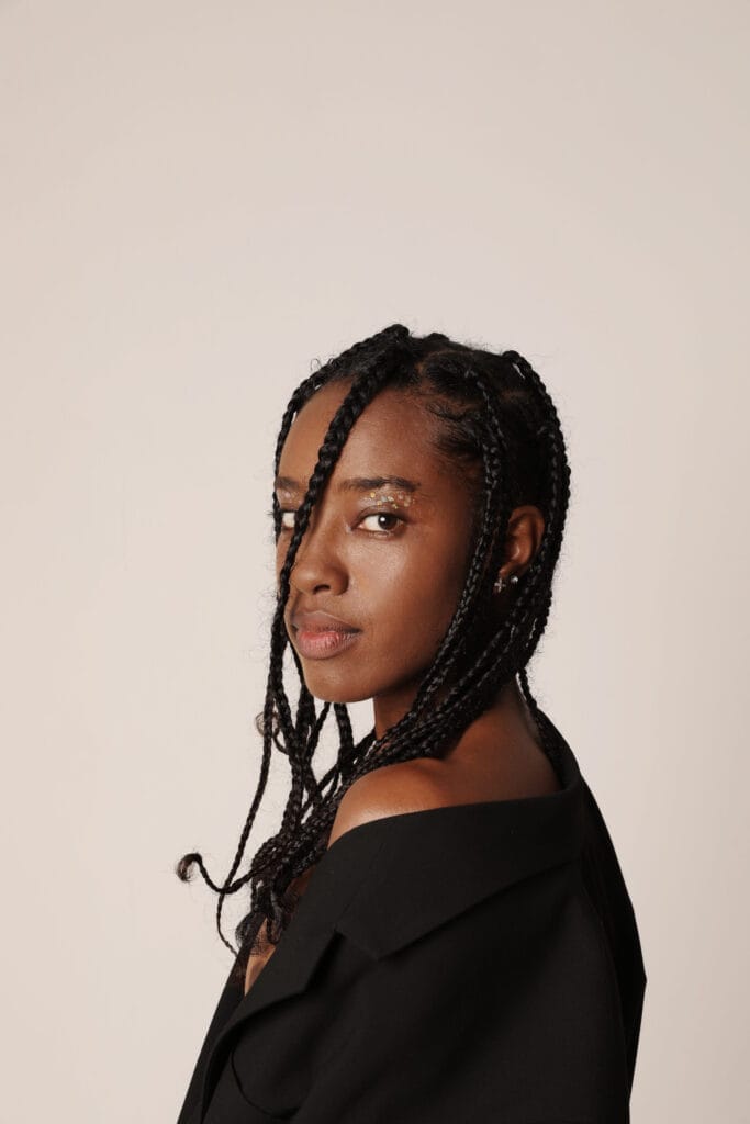 Close-up portrait of African American young woman looking at the camera.